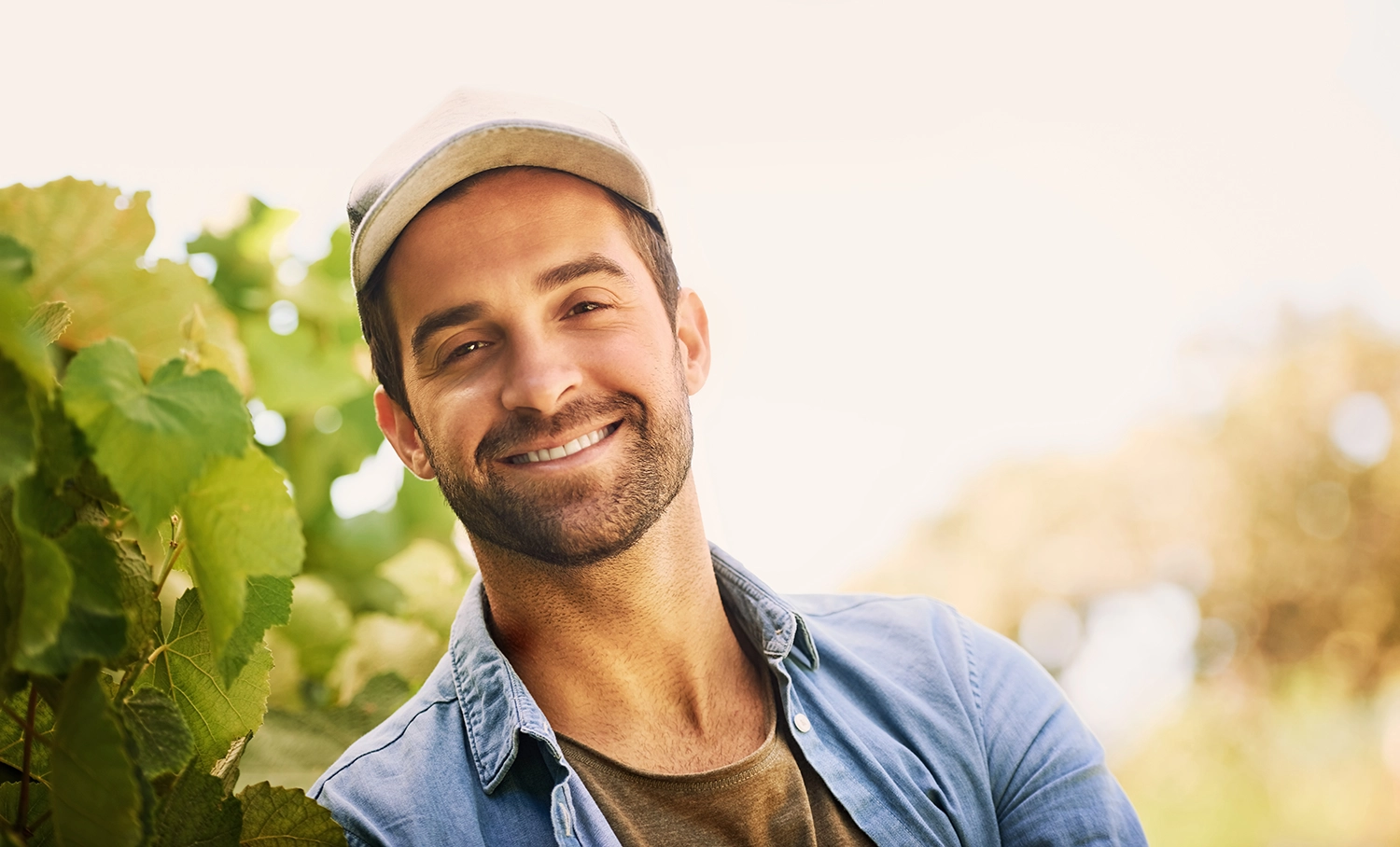 Man in casual shirt smiling happily - Dental Implants- oak Mountain Denture and Implant Center