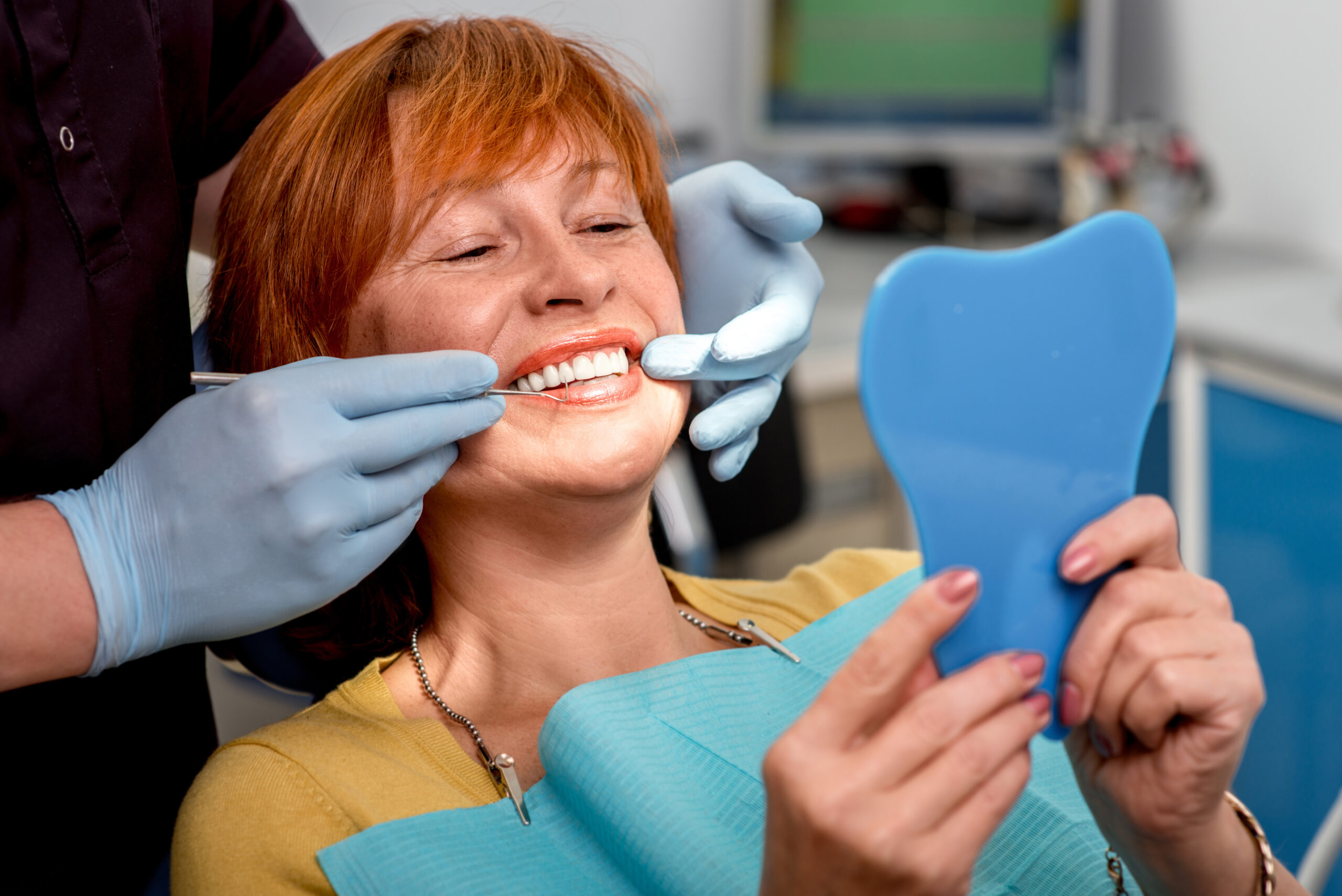 Happy satisfied senior dental patient with dentures and implants - Oak Mountain Denture and Implant Center