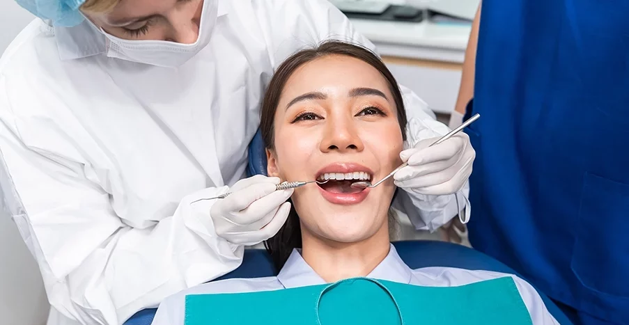 Close-up of dental bridge model showing gum and teeth